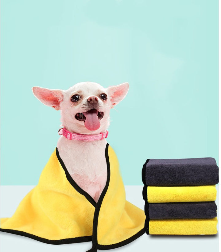 Pet supplies absorbent towel with a cute dog wrapped in a yellow towel next to stacked towels.